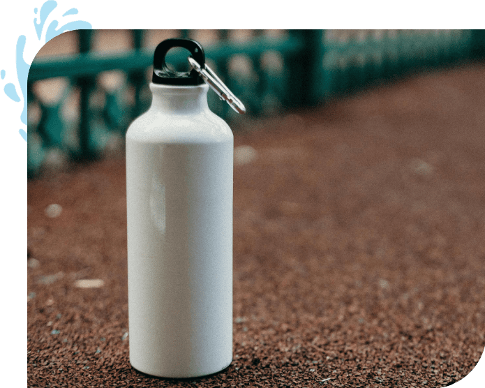 A white water bottle sitting on the ground.